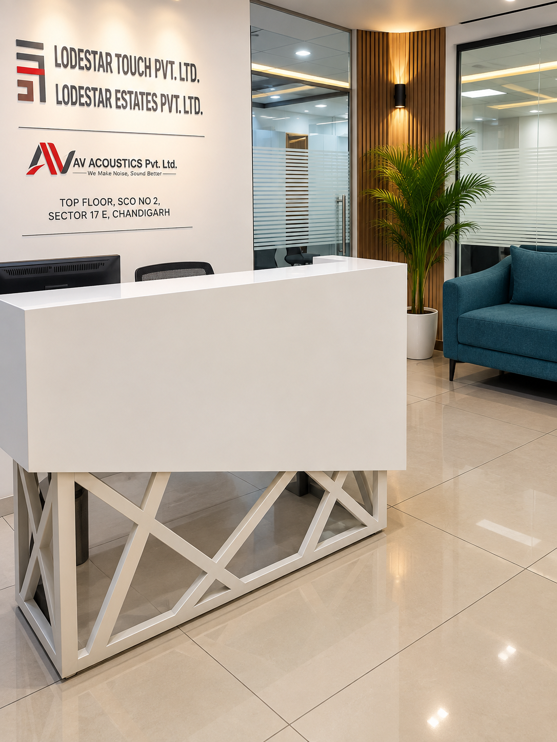 The AV Acoustics reception desk, with the company signboard and the Sector 17-E address behind it.